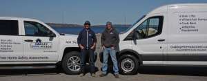 owners standing in front of their trucks