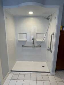 A barrier free or roll in shower is shown in this photo as we take a closer look at the tub cut and barrier free shower.