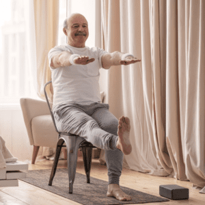 A seated man performs exercises to help with balance.