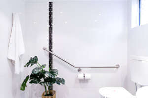 bathroom-with-accent-lighting-and-handle-bar