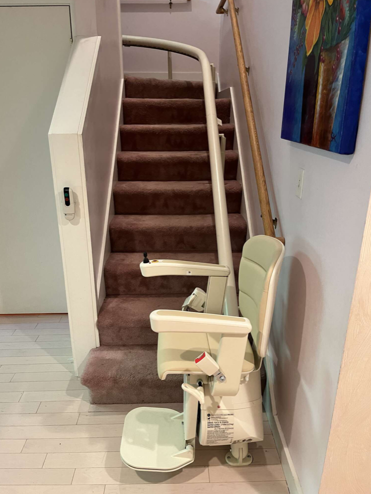 Compact Stair Lift on a Curved Indoor Staircase