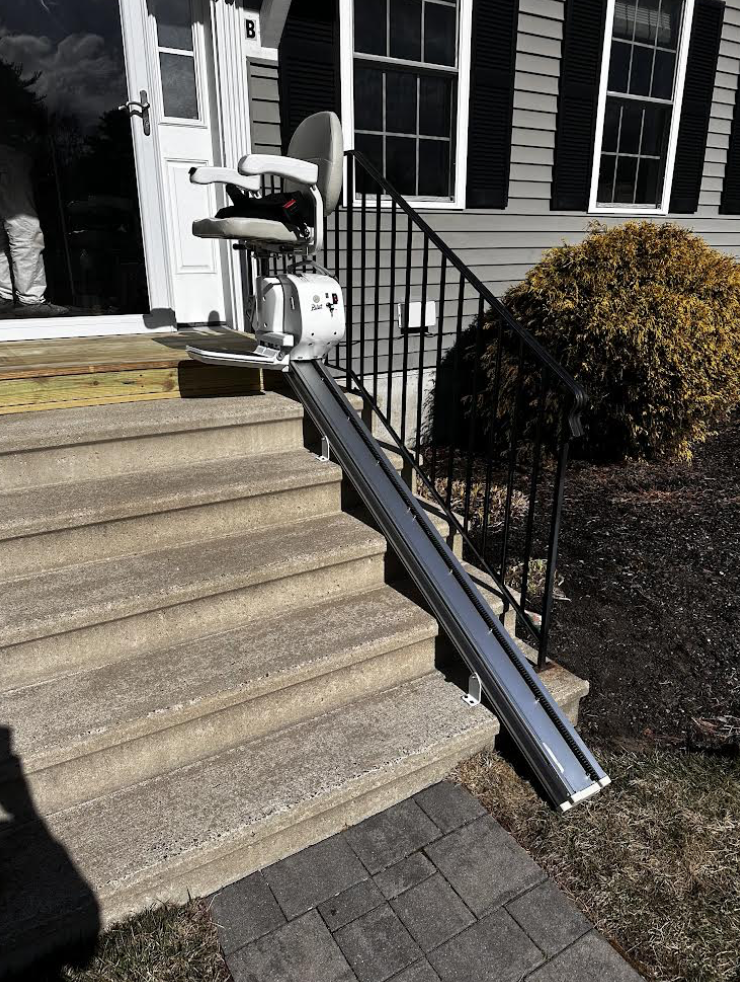 Outdoor Stair Lift Installed Along Front Entrance Steps